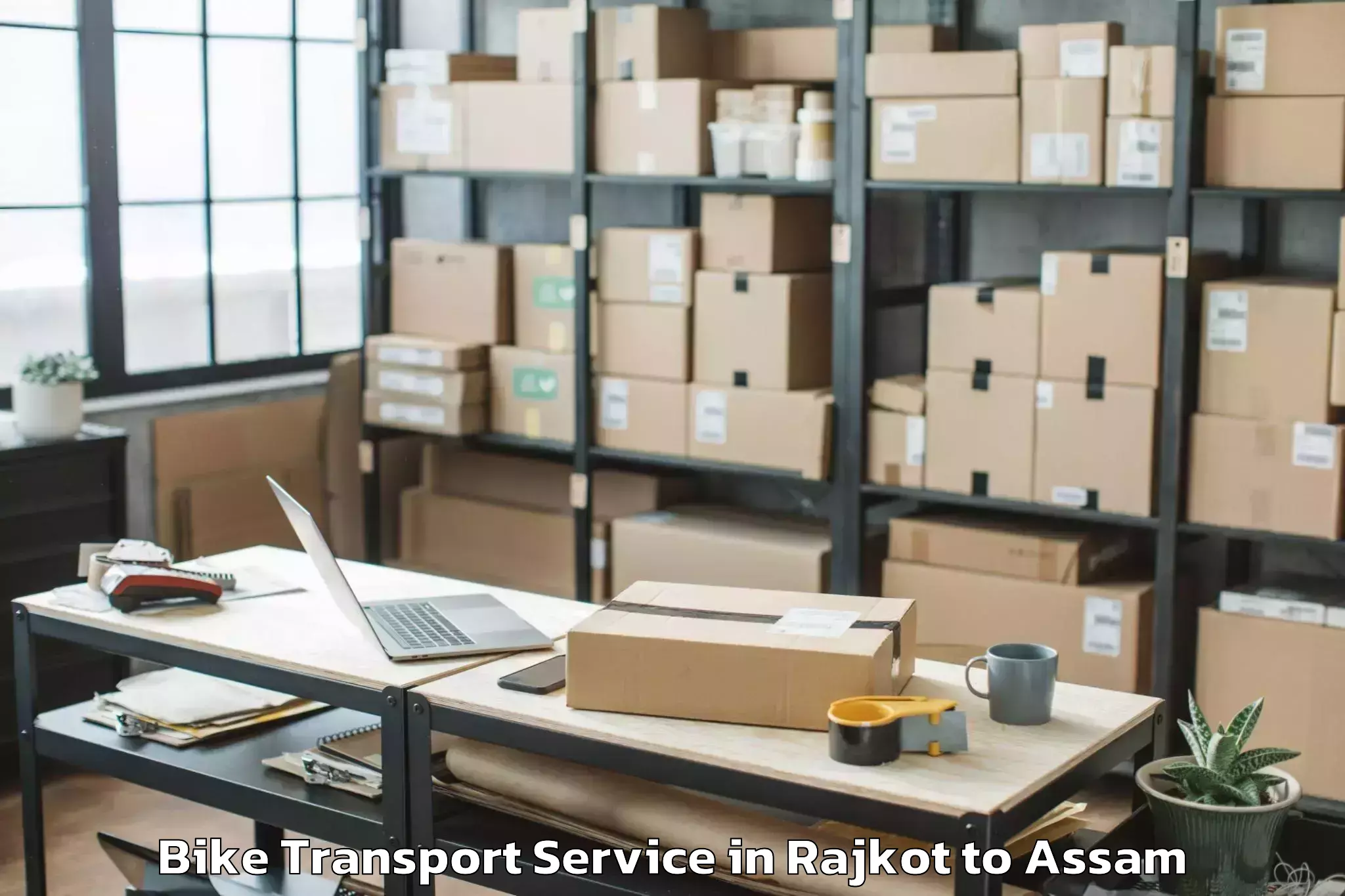 Book Rajkot to Rangia Bike Transport Online